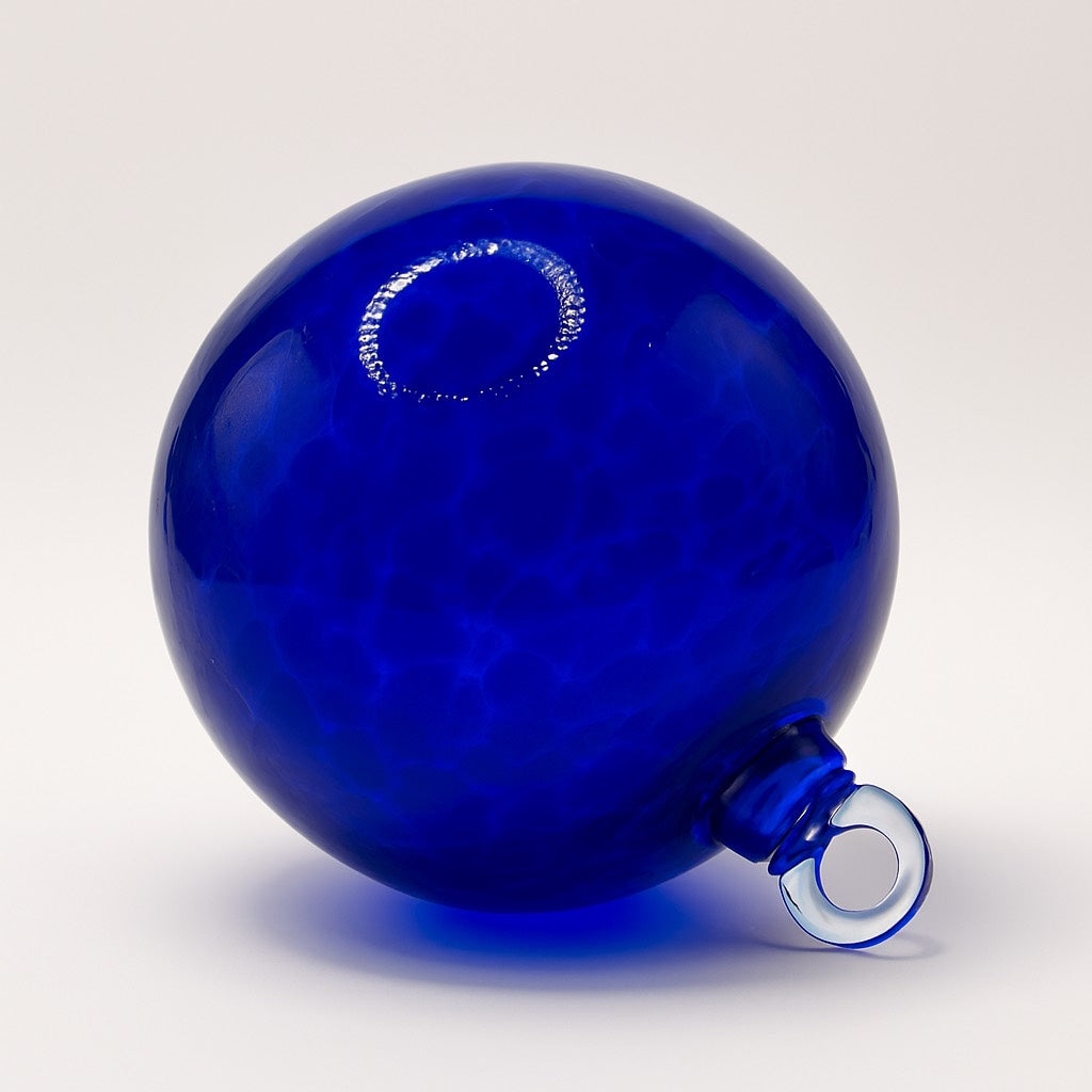 Hand-blown Cobalt Blue glass ornament with deep gemstone-like color and smooth clarity from Puget Sound Glassblowing Studio.