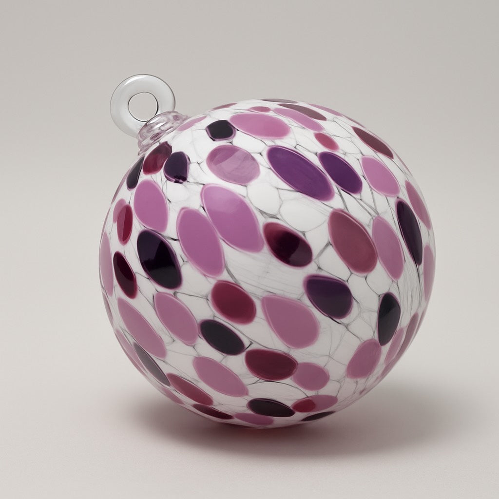 Hand-blown purple and white glass ornament with lavender, plum, and black spotted pattern by Puget Sound Glassblowing Studio. 
