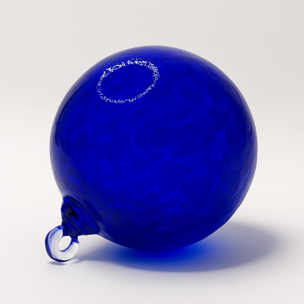 Hand-blown Cobalt Blue glass ornament with deep gemstone-like color and smooth clarity from Puget Sound Glassblowing Studio.